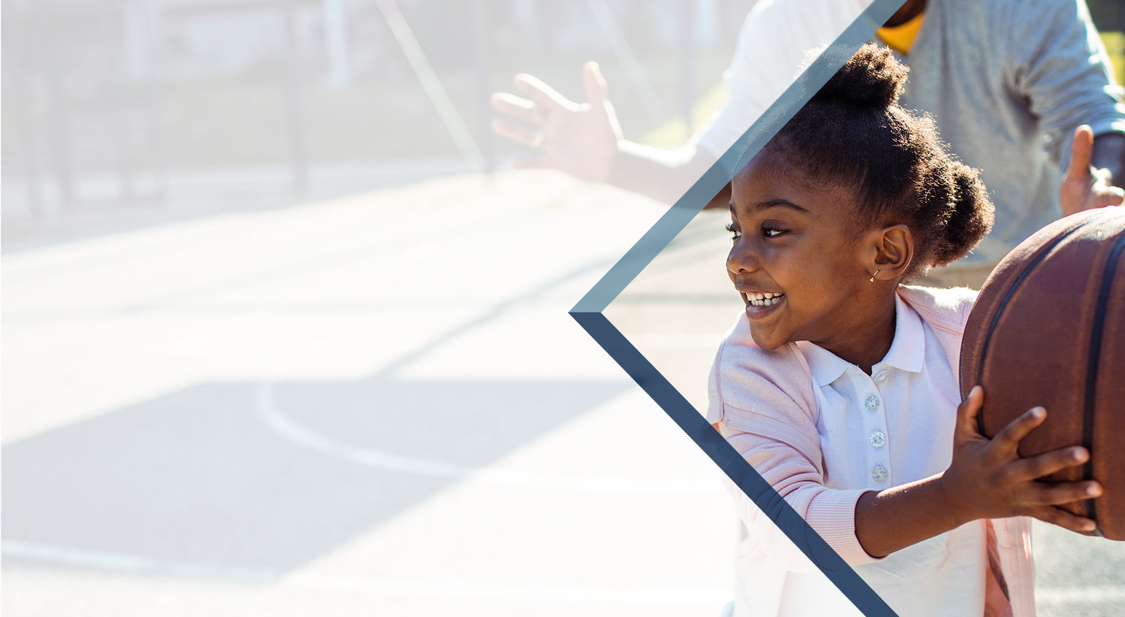 Young girl playing basketball